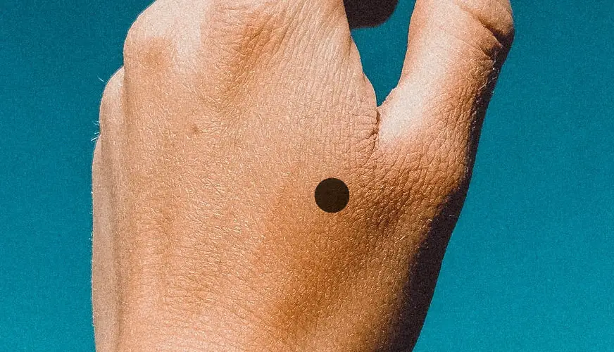 1 Dot Tattoo Meaning & Symbolism
