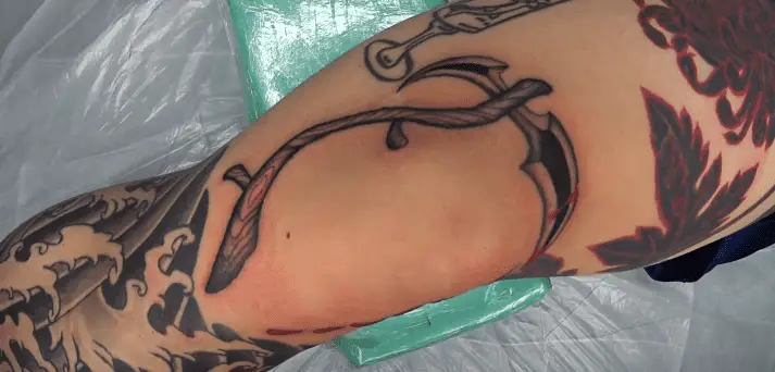 Scythe Tattoo Meaning & Symbolism
