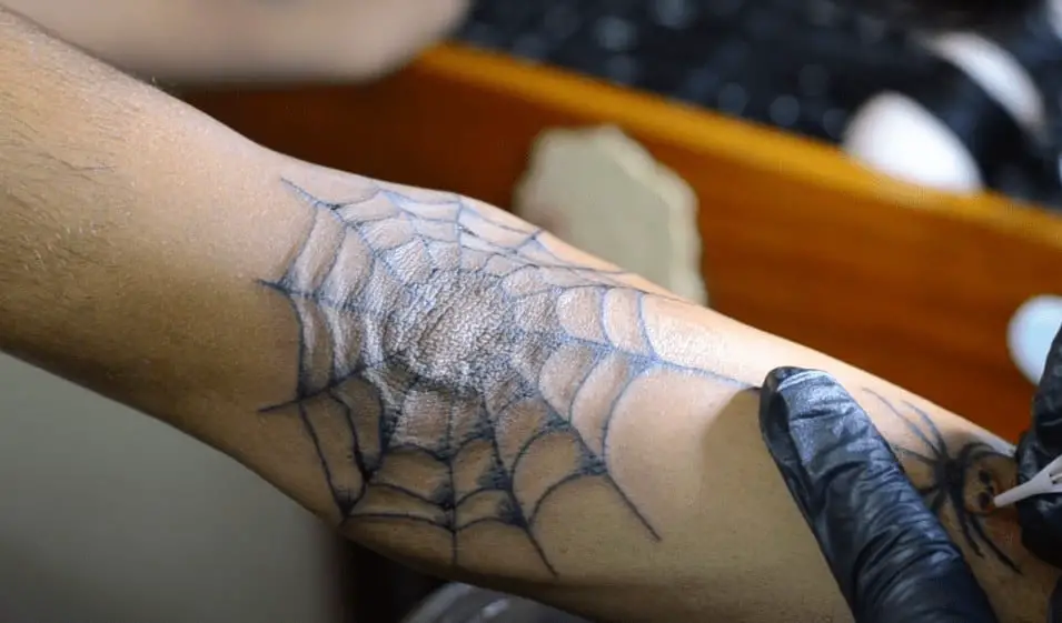Spider Web Elbow Tattoo Meaning