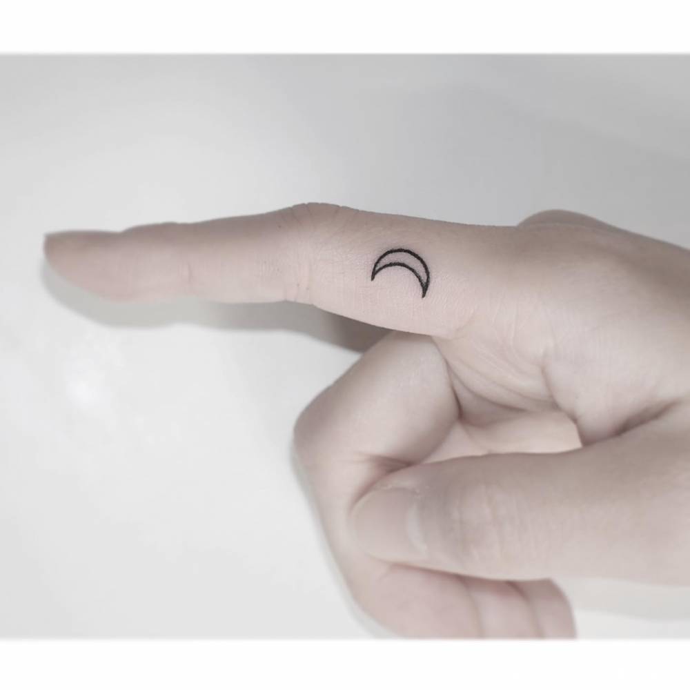 Moon on Finger Tattoo Symbolism