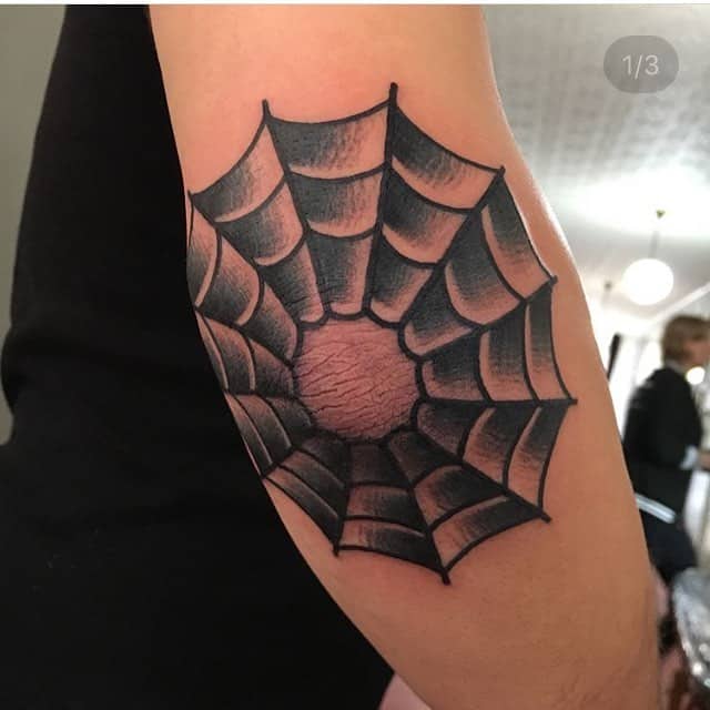 Spider Web Elbow Tattoo Meaning